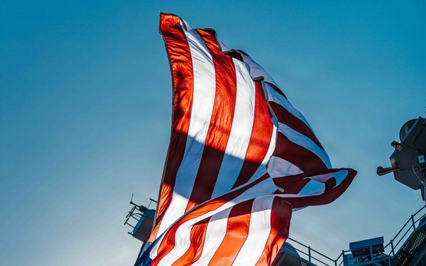 Battle Ensign Raised on USS George Washington Mast