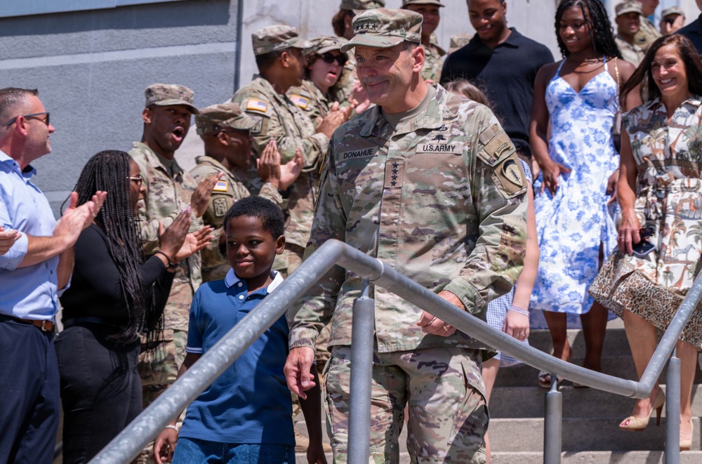 U.S. Army Gen. Christopher Donahue descends the steps of the Mission Command Center