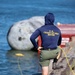 U.S. Coast Guard divers conduct safety inspections for Sail250