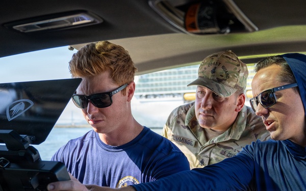 U.S. Coast Guard divers conduct safety inspections for Sail250