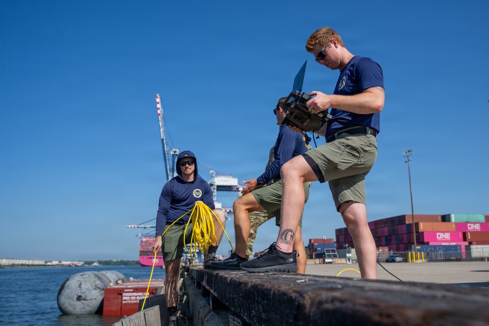 U.S. Coast Guard divers conduct safety inspections for Sail250