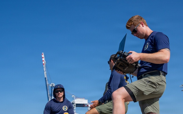 U.S. Coast Guard divers conduct safety inspections for Sail250