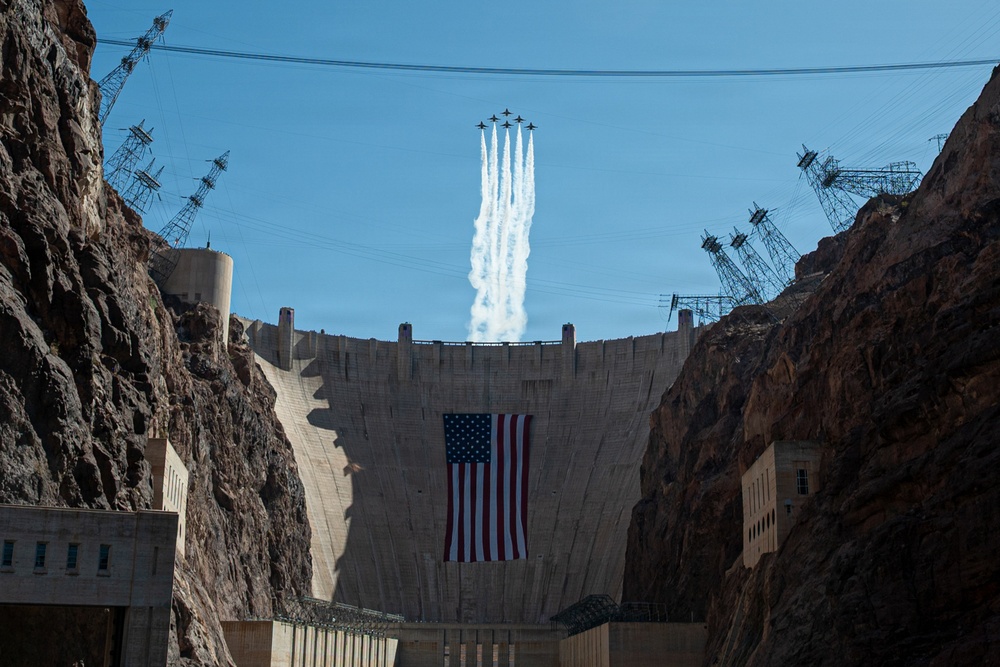 USAF Thunderbirds fly over Hoover Dam with historic American Flag