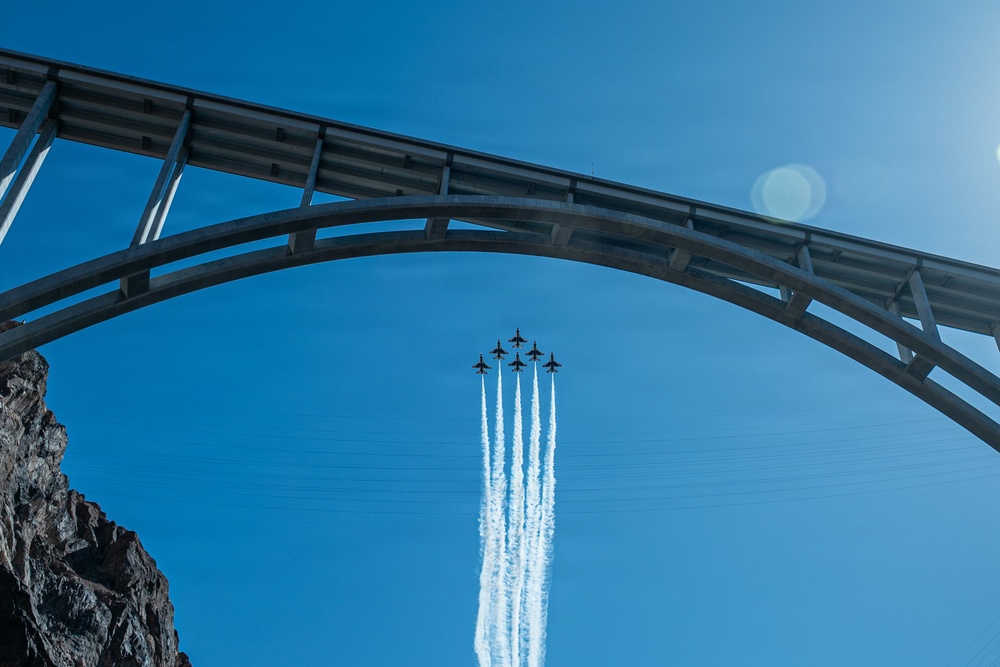 USAF Thunderbirds fly over Hoover Dam with historic American Flag