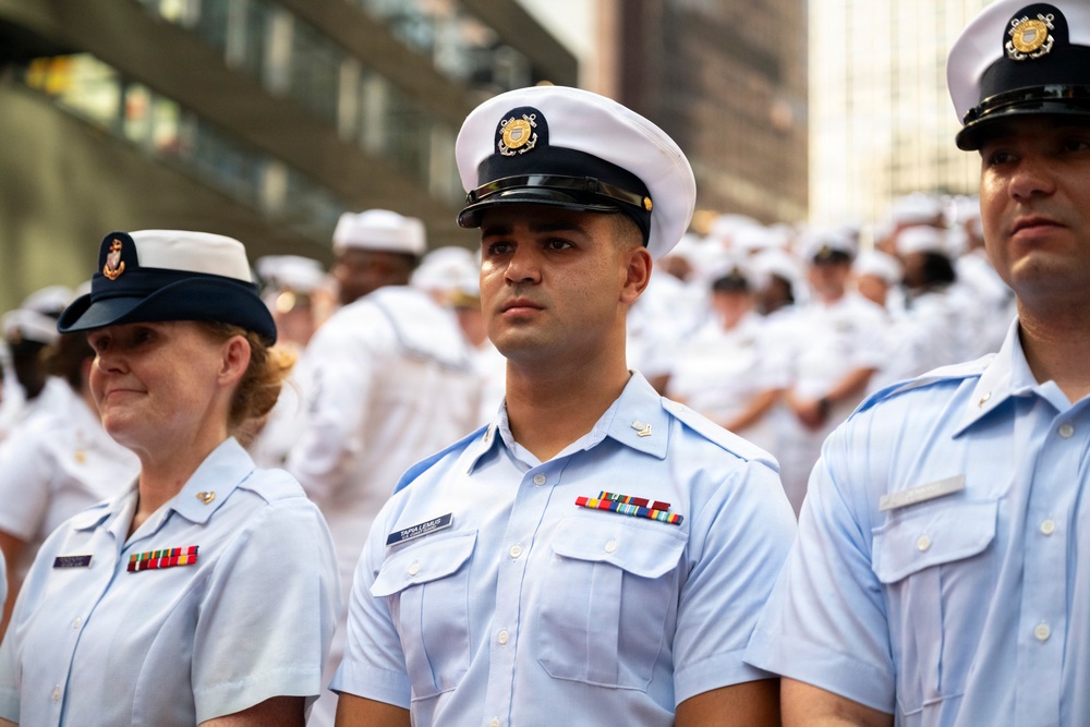 Coast Guard members assemble in Times Square during Sail 250