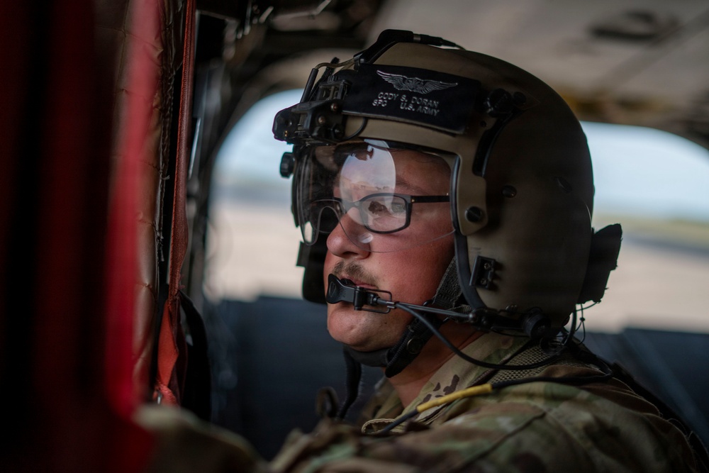 1st AD Combat Aviation Brigade and 62nd Engineer Battalion take off during sling load ops