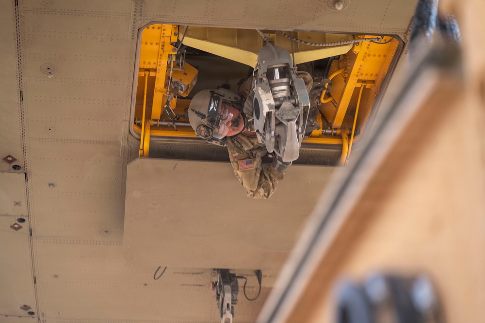 1st AD Combat Aviation Brigade and 62nd Engineer Battalion take off during sling load ops