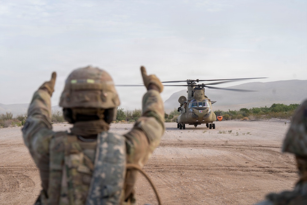 1st AD Combat Aviation Brigade and 62nd Engineer Battalion take off during sling load ops