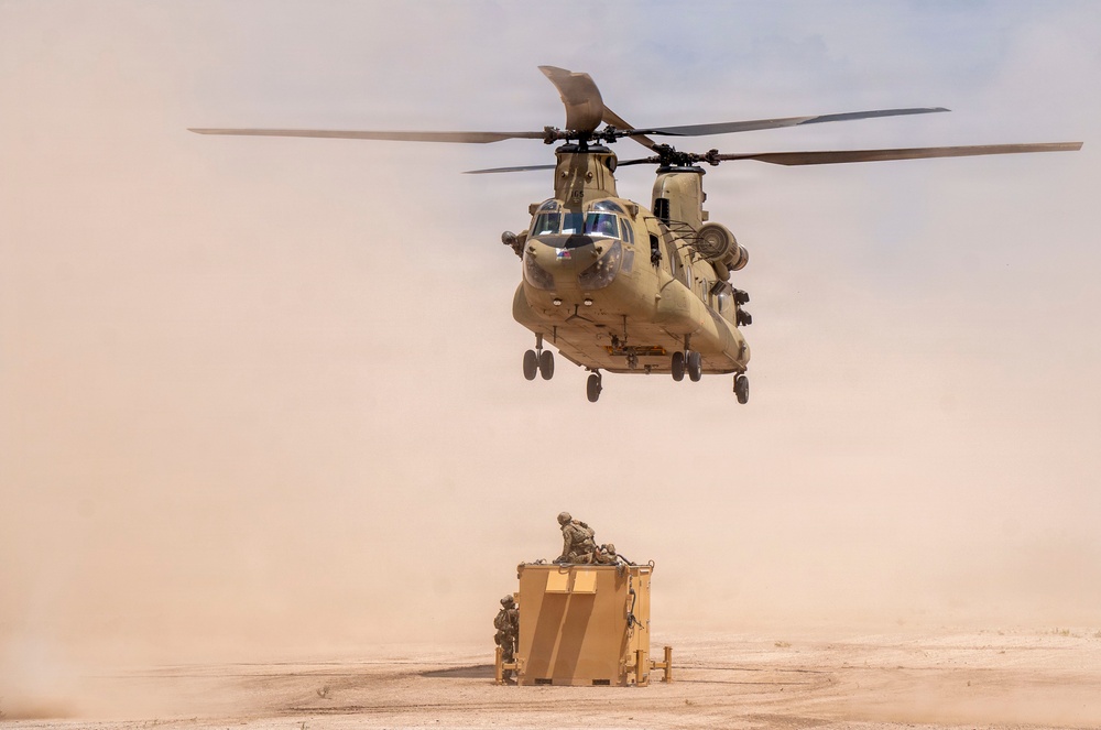 1st AD Combat Aviation Brigade and 62nd Engineer Battalion take off during sling load ops