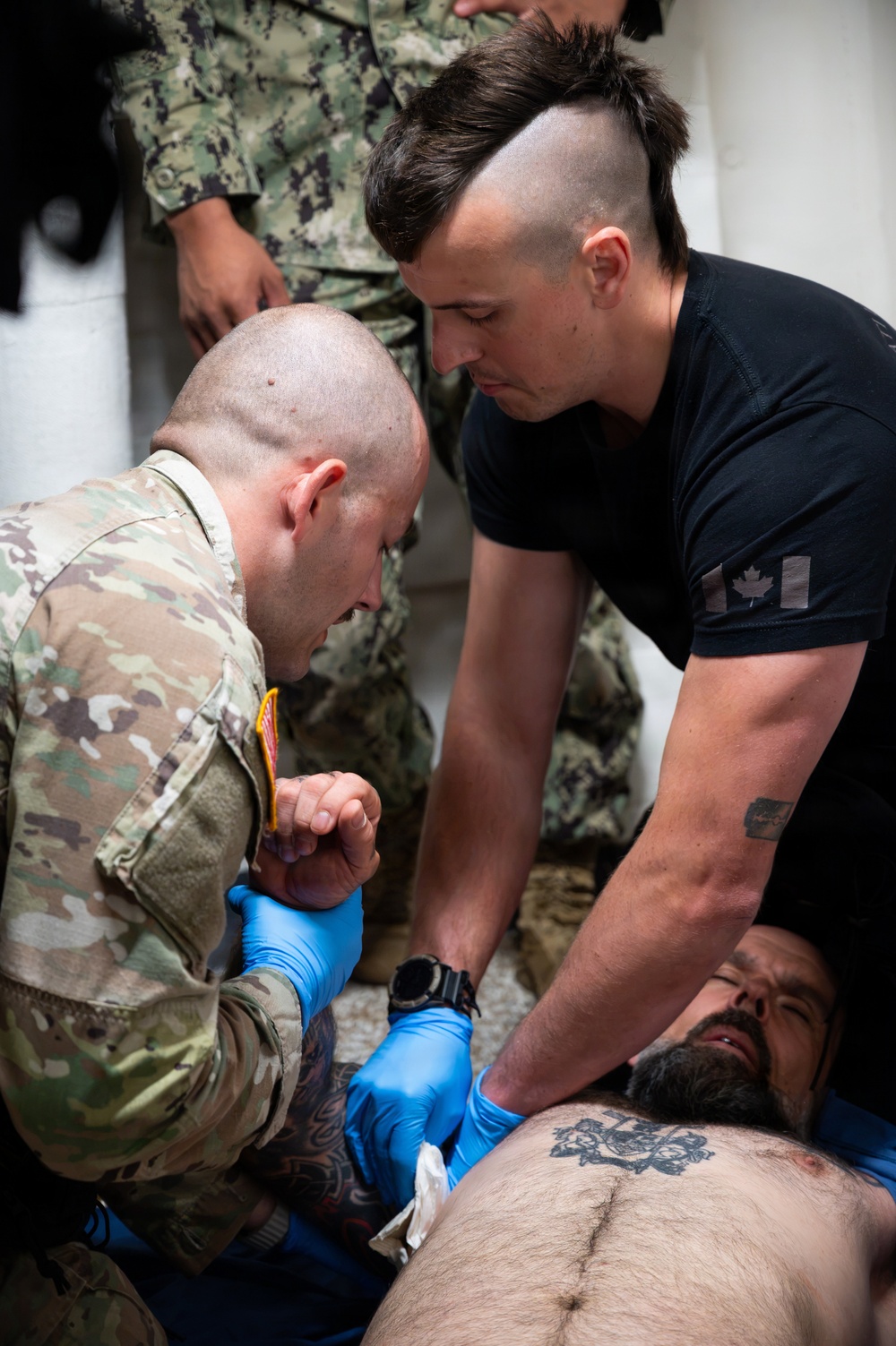 Partner nations participate in Tactical Combat Casualty Care training scenarios during RIMPAC 2026