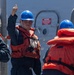 USS Mustin conducts boat operations