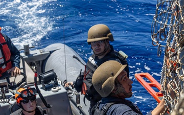 USS Mustin conducts boat operations