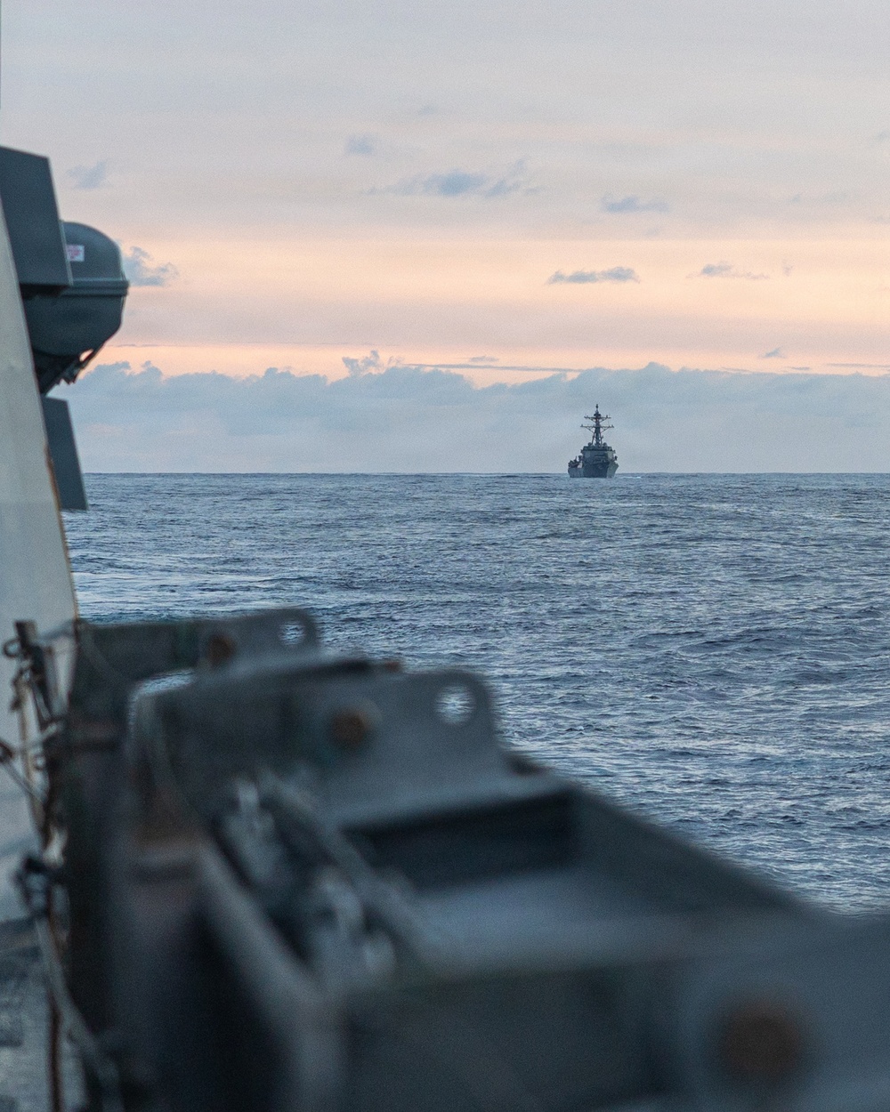 USS Mustin conducts a replenishment-at-sea with USNS Wally Schirra