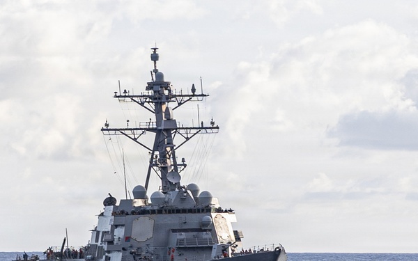 USS Mustin conducts a replenishment-at-sea with USNS Wally Schirra