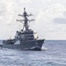 USS Mustin conducts a replenishment-at-sea with USNS Wally Schirra