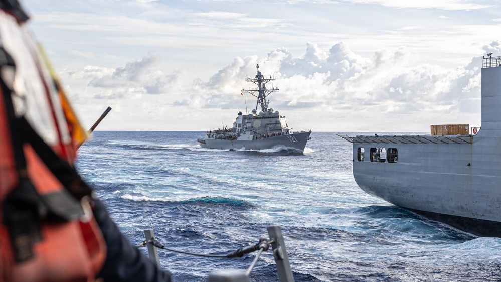USS Mustin conducts a replenishment-at-sea with USNS Wally Schirra