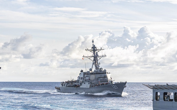 USS Mustin conducts a replenishment-at-sea with USNS Wally Schirra