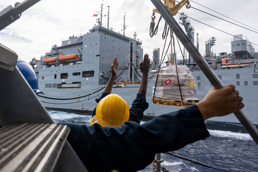 USS Mustin conducts a replenishment-at-sea with USNS Wally Schirra