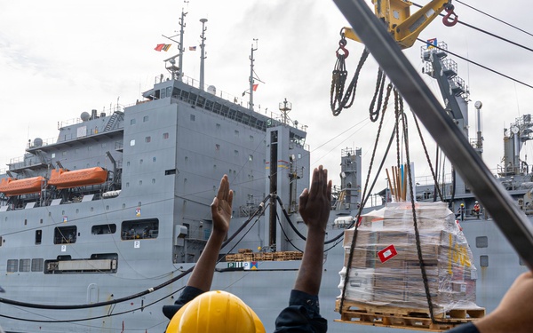 USS Mustin conducts a replenishment-at-sea with USNS Wally Schirra