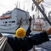 USS Mustin conducts a replenishment-at-sea with USNS Wally Schirra