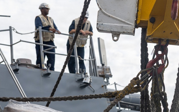 USS Mustin conducts a replenishment-at-sea with USNS Wally Schirra