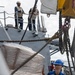 USS Mustin conducts a replenishment-at-sea with USNS Wally Schirra