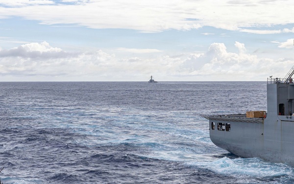USS Mustin conducts a replenishment-at-sea with USNS Wally Schirra