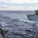 USS Mustin conducts a replenishment-at-sea with USNS Wally Schirra