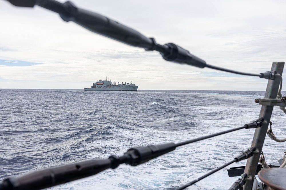 USS Mustin conducts a replenishment-at-sea with USNS Wally Schirra