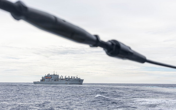 USS Mustin conducts a replenishment-at-sea with USNS Wally Schirra