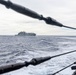 USS Mustin conducts a replenishment-at-sea with USNS Wally Schirra