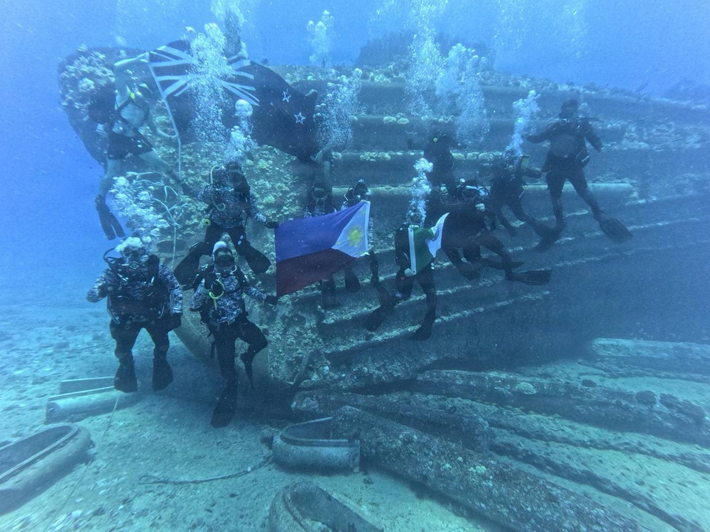 PCG, RNZN Divers Display National Flags Outside Pearl Harbor During RIMPAC 2026
