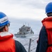 USS Mustin conducts a replenishment-at-sea with USNS Wally Schirra