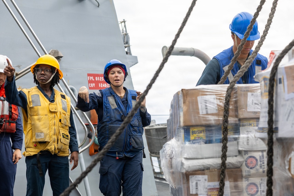 USS Mustin conducts a replenishment-at-sea with USNS Wally Schirra