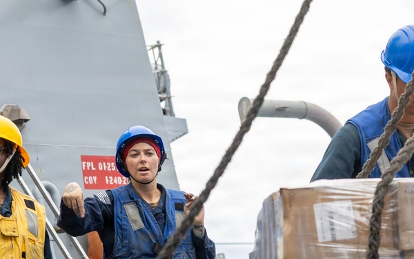 USS Mustin conducts a replenishment-at-sea with USNS Wally Schirra