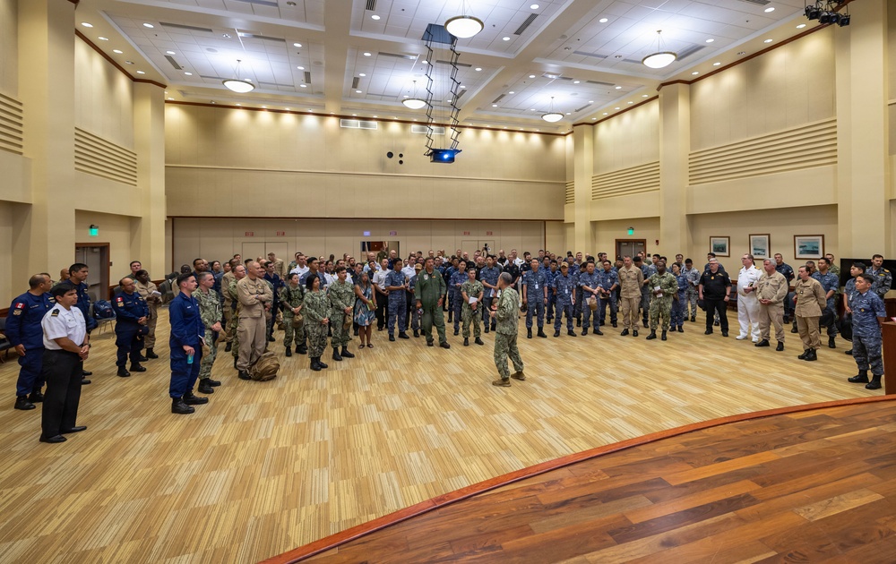 Multinational ship commands attend the PHOTOEX brief for RIMPAC 2026
