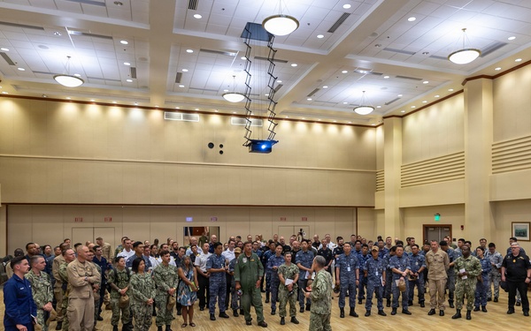 Multinational ship commands attend the PHOTOEX brief for RIMPAC 2026