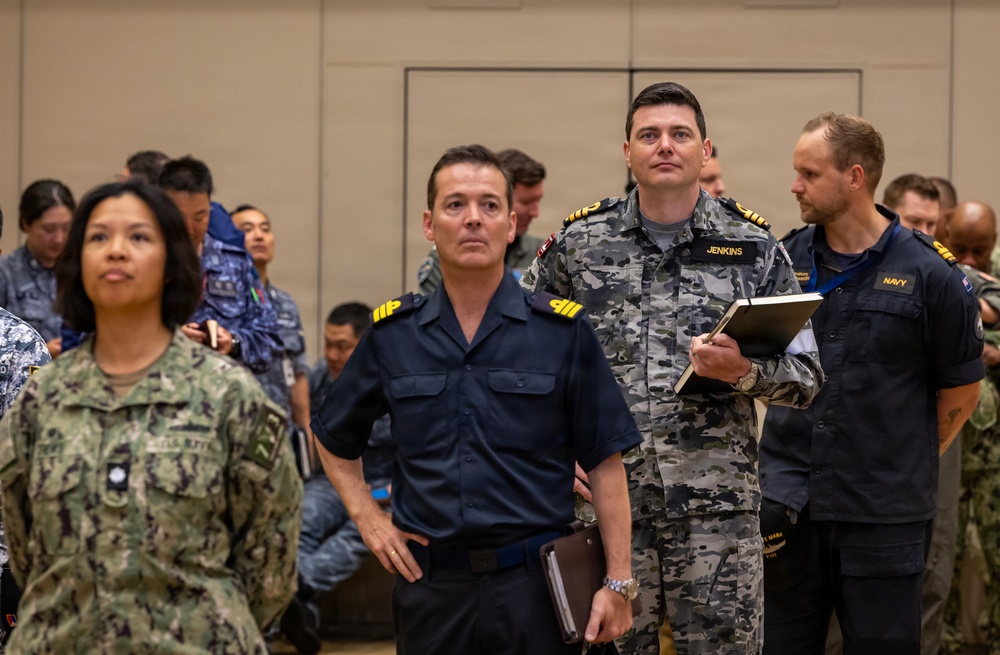 Multinational ship commands attend the PHOTOEX brief for RIMPAC 2026