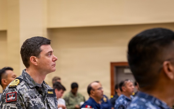 Multinational ship commands attend the PHOTOEX brief for RIMPAC 2026