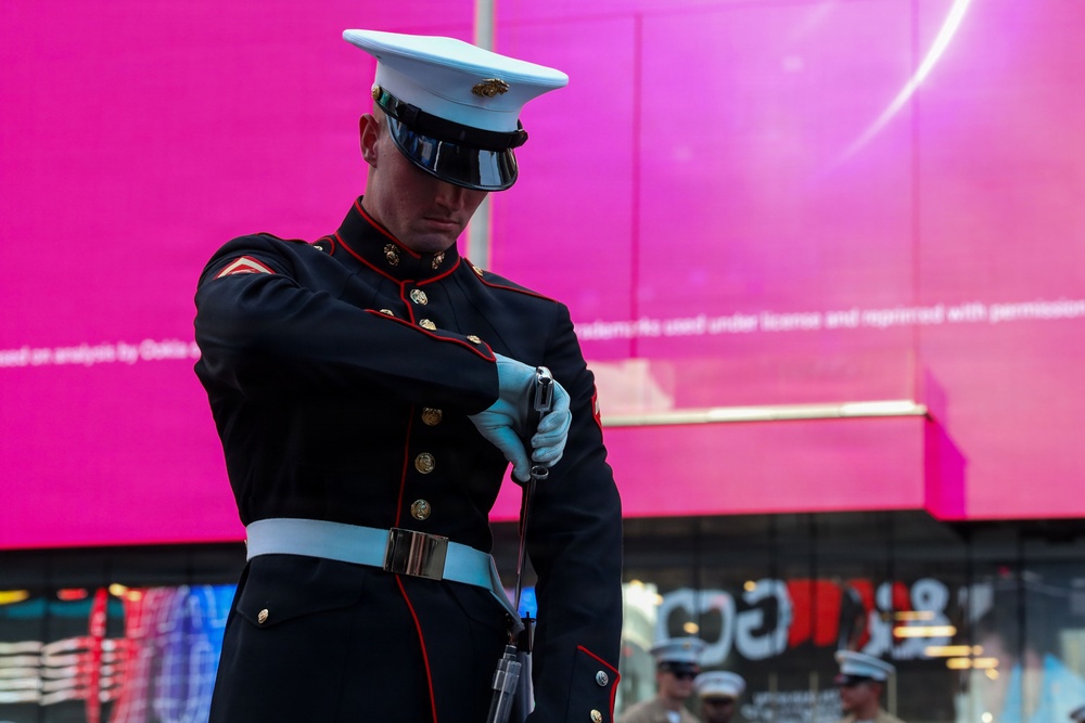 U.S. Marine Corps Silent Drill Platoon performs at Time Square for INR250