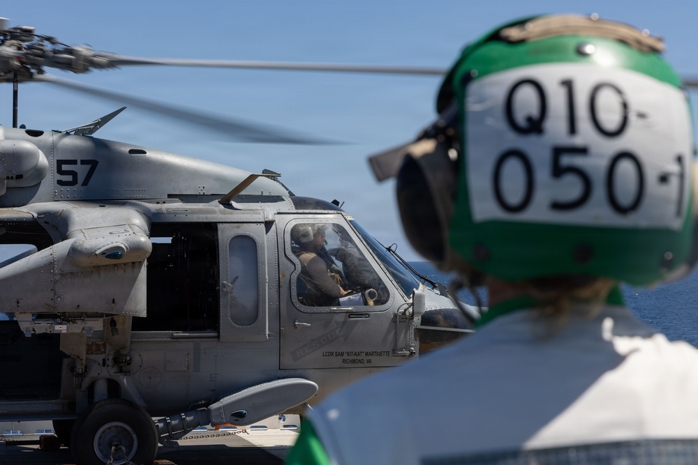 MV-22B Ospreys and MH-60 Seahawk execute embarking procedures on USS Makin Island
