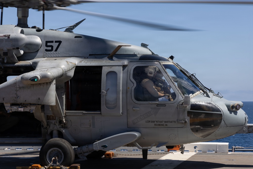 MV-22B Ospreys and MH-60 Seahawk execute embarking procedures on USS Makin Island