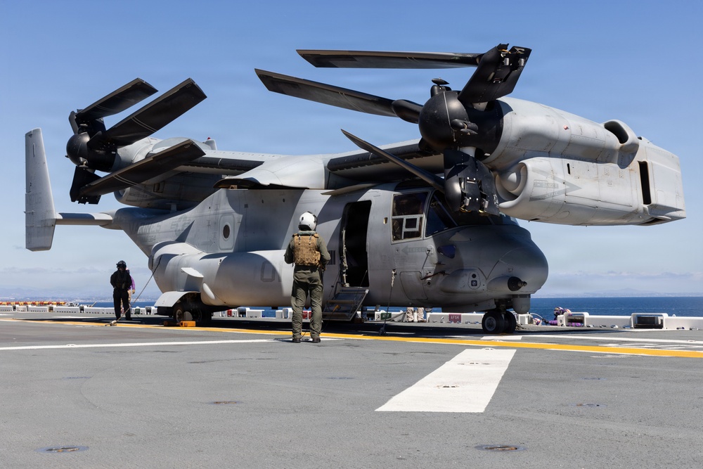 MV-22B Ospreys and MH-60 Seahawk execute embarking procedures on USS Makin Island