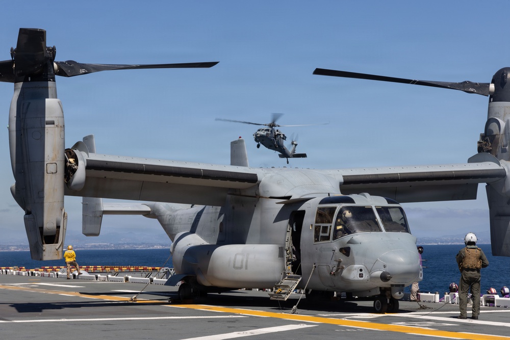 MV-22B Ospreys and MH-60 Seahawk execute embarking procedures on USS Makin Island