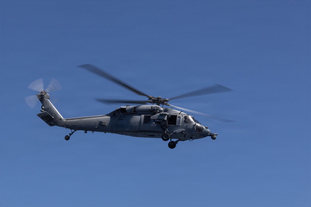 MV-22B Ospreys and MH-60 Seahawk execute embarking procedures on USS Makin Island