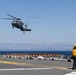 MV-22B Ospreys and MH-60 Seahawk execute embarking procedures on USS Makin Island