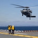 MV-22B Ospreys and MH-60 Seahawk execute embarking procedures on USS Makin Island