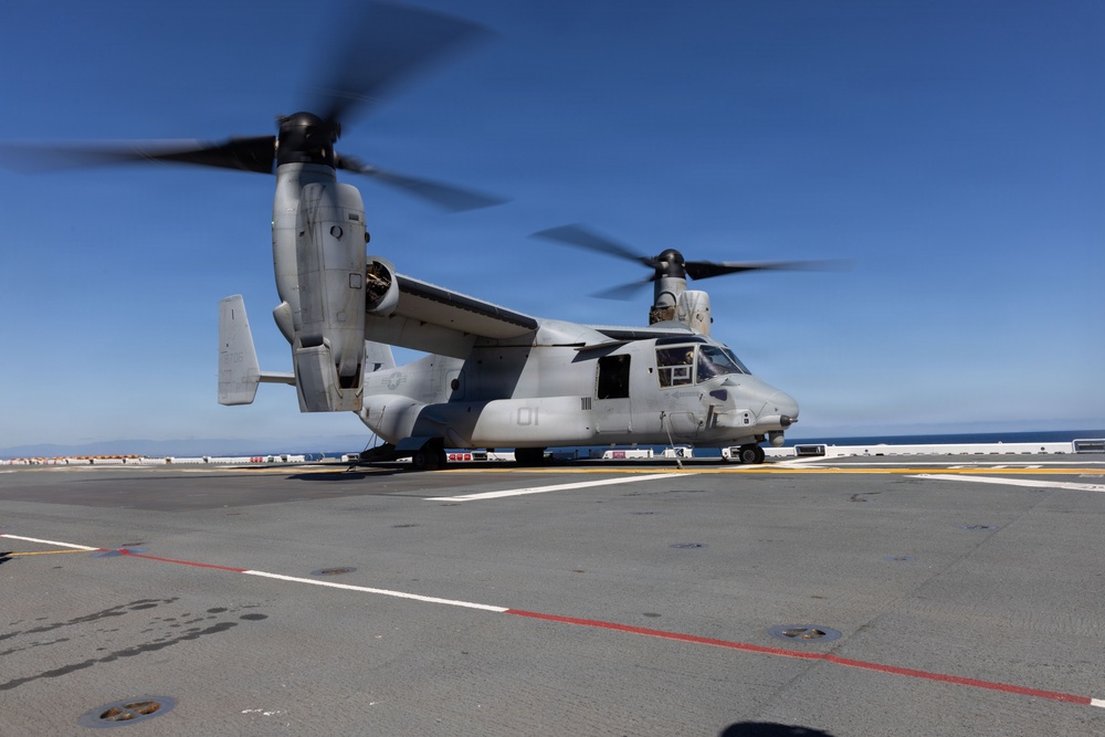 MV-22B Ospreys and MH-60 Seahawk execute embarking procedures on USS Makin Island
