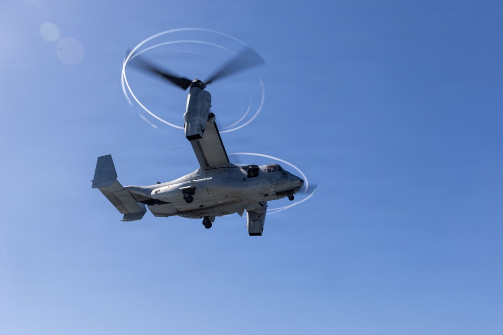 MV-22B Ospreys and MH-60 Seahawk execute embarking procedures on USS Makin Island