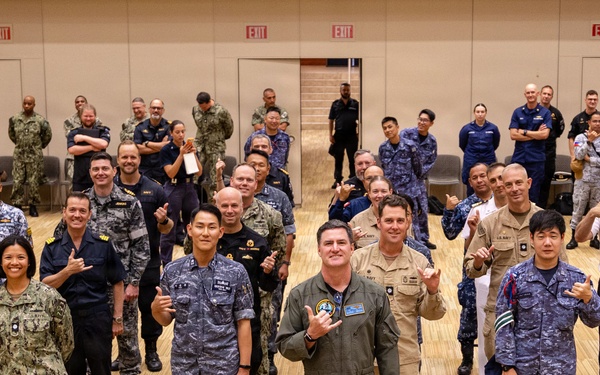 RIMPAC 2026 Participants Throw Shaka Sign Ahead of Photo Exercise